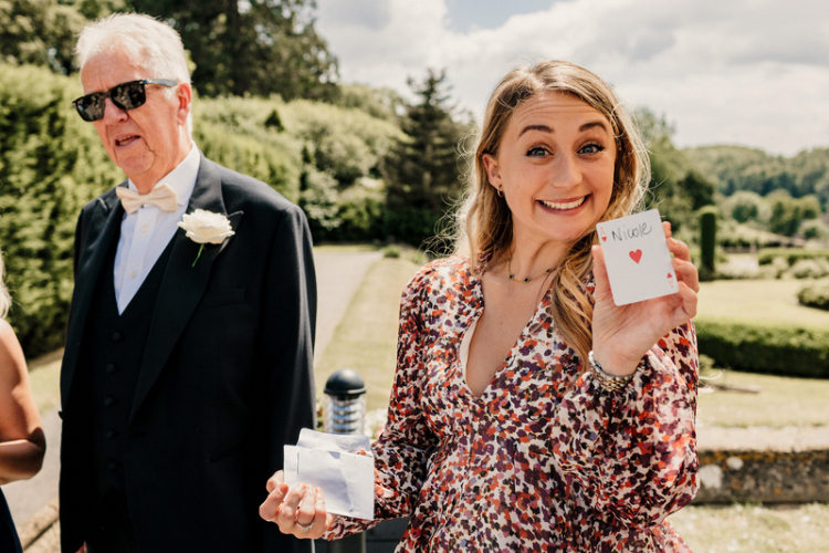 De Vere Tortworth Court wedding venue photo of a guest enjoying magic tricks