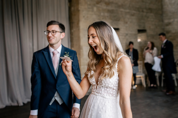 Bride and Groom enjoying close up magic tricks at Lapstone Barn